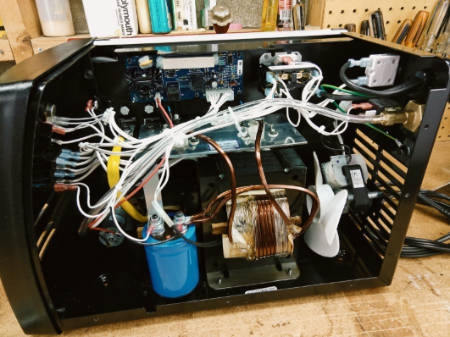 Shows internal view of Hobart 140 MIG welder (cover removed).
