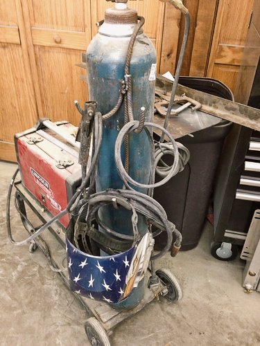 MIG cable organizer welded from recycled scrap metal.