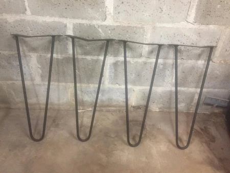 Welded metal hairpin legs for coffee table.