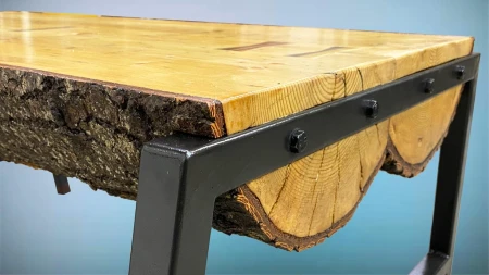 Rustic log table with welded base.