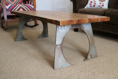 Scrap metal coffee table with wood top.
