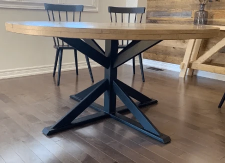 Metal pedestal table with round wood top
